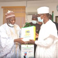 NRC Board chairman making presentation to the Hon. Minster, FCT during a courtesy visit to the Minister